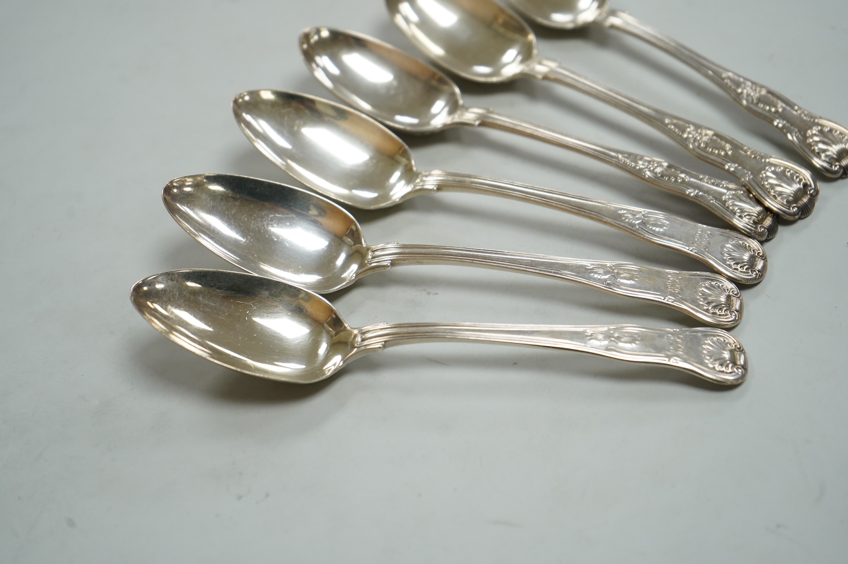 A matched set of six Victorian silver Kings pattern dessert spoons, including three by George Adams, London, 1865, 11.9oz.